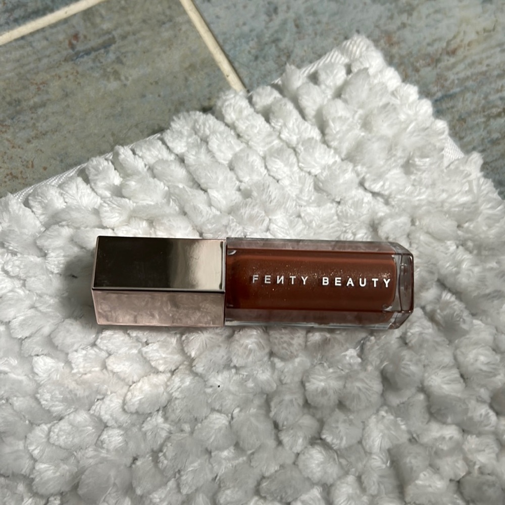 Gently Beauty Gloss Bomb, Fenty Glow; 9mL bottle.